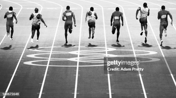 Usain Bolt of Jamaica races ahead of Ryan Bailey of the United States, Yohan Blake of Jamaica, Justin Gatlin of the United States and Tyson Gay of...