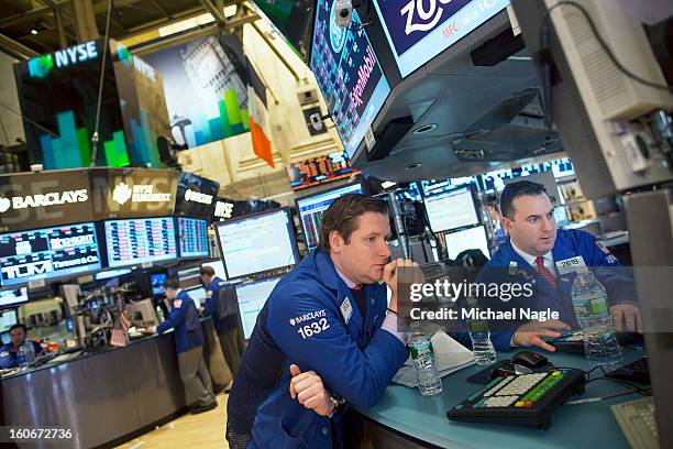 Traders work on the floor of the New York Stock Exchange at the end of the trading day on February 4, 2013 in New York City. Stocks dropped sharply...
