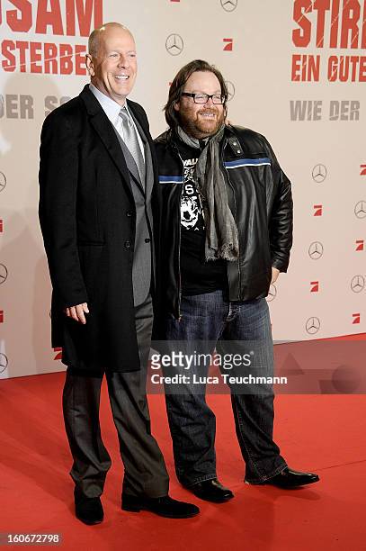 John Moore and Bruce Willis attend the premiere of 'Die Hard - Ein Guter Tag Zum Sterben' at Sony Center on February 4, 2013 in Berlin, Germany.