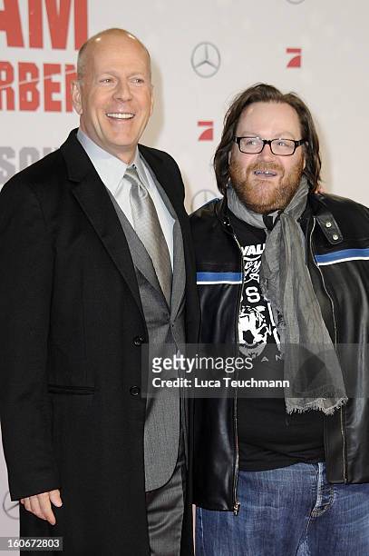 John Moore and Bruce Willis attend the premiere of 'Die Hard - Ein Guter Tag Zum Sterben' at Sony Center on February 4, 2013 in Berlin, Germany.