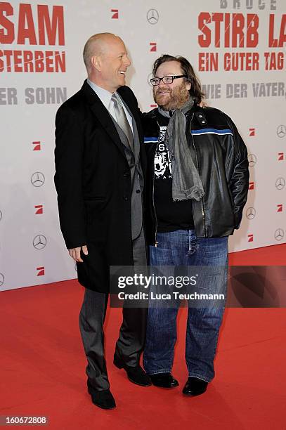 John Moore and Bruce Willis attend the premiere of 'Die Hard - Ein Guter Tag Zum Sterben' at Sony Center on February 4, 2013 in Berlin, Germany.