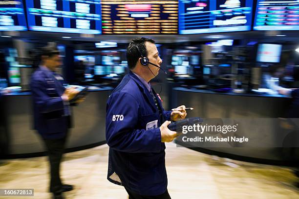 Trader works on the floor of the New York Stock Exchange at the end of the trading day on February 4, 2013 in New York City. Stocks dropped sharply...