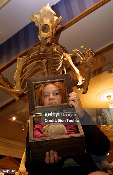 Marketing officer Alison Driver holds a Therizinosaur egg August 3, 2001 at the Fortnum and Mason''s exclusive department store in London, United...