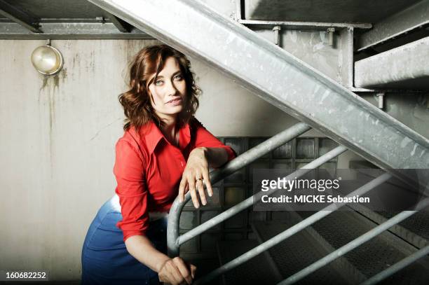 Attitude'' Emmanuelle Devos posing in the'' staircase leading to the roof of the Grand Hotel de Cabourg.