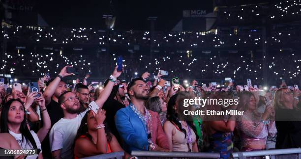 Fans watch a video onstage at the beginning of Karol G's first show of her Mañana Será Bonito tour at Allegiant Stadium on August 10, 2023 in Las...