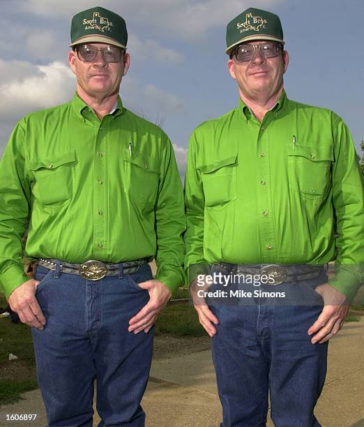 Twin brothers Ralph, left, and Russell Scott pose for a photo during the Twinsburg Twins Days Festival August 3, 2001 in Twinsburg, Ohio.