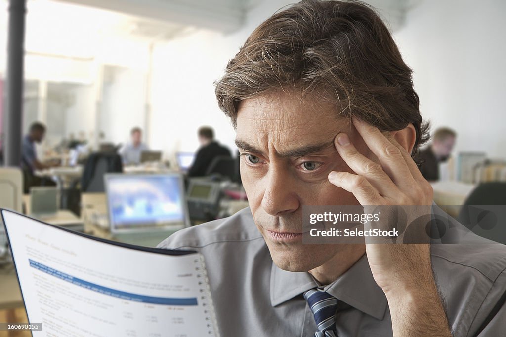 Business man going over report