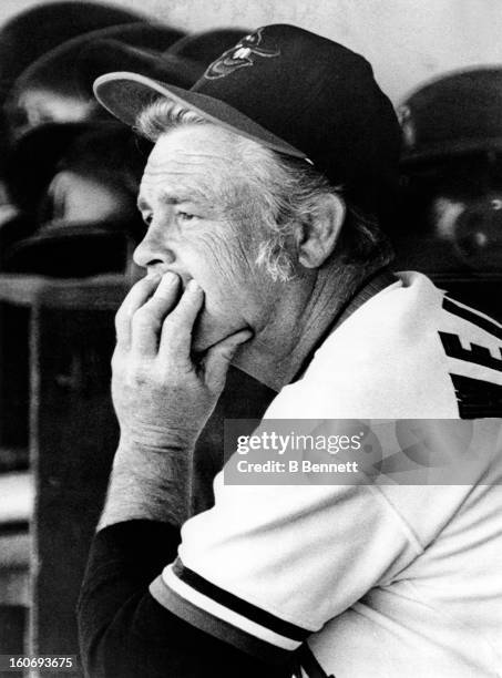 Manager Earl Weaver of the Baltimore Orioles watches from the dugout during a spring training game against the Pittsburgh Pirates on March 18, 1973...