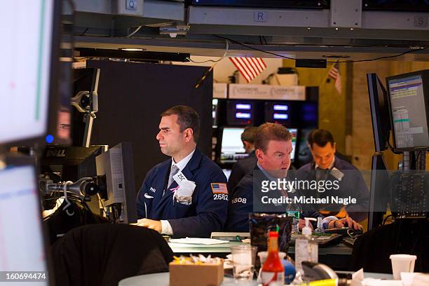 Traders work on the floor of the New York Stock Exchange on February 4, 2013 in New York City. Stocks dropped sharply today following the Dow's close...
