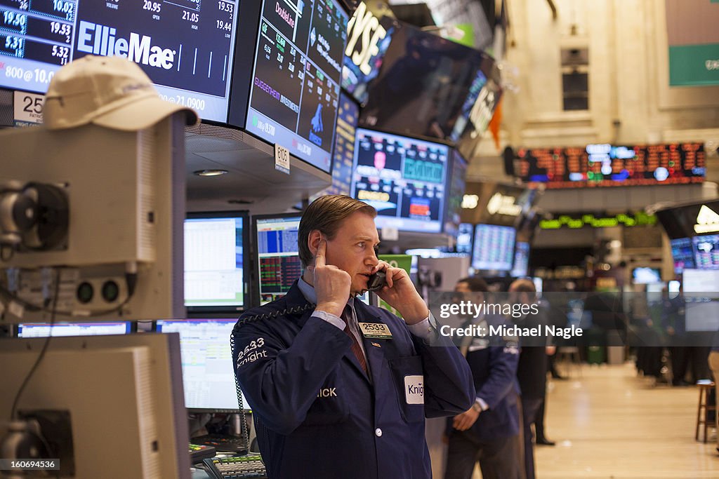 Stocks Drop Sharply, Dow Dips Below 14,000