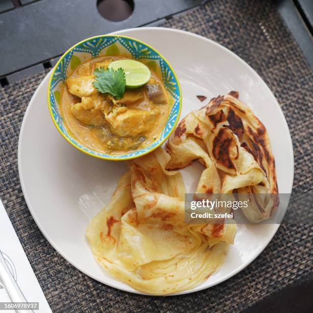 malaysian cuisine roti canai, indian food with chicken curry - roti canai stock pictures, royalty-free photos & images