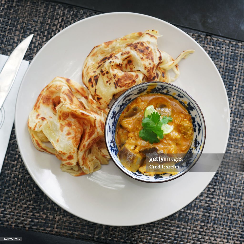 Malaysian Cuisine Roti Canai, Indian food with vegetable curry sauce