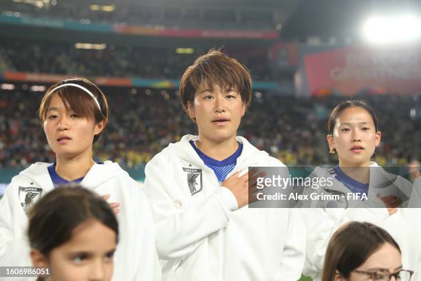 Hinata Miyazawa, Chika Hirao and Fuka Nagano of Japan line up for the national anthem prior to the FIFA Women's World Cup Australia & New Zealand...