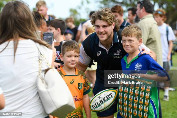 Fraser McReight of the Wallabies poses for a photo with young fans at the at Wallabies Community Event after the Australia Wallabies training session...