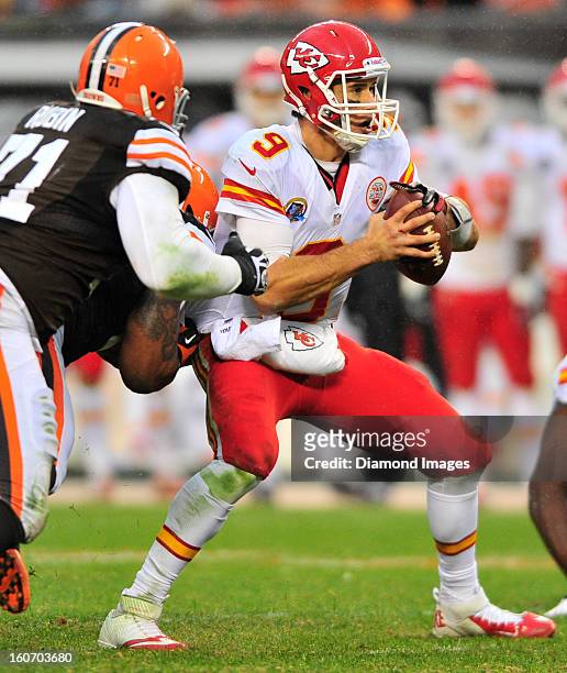 Quarterback Brady Quinn of the Kansas City Chiefs is pressured by line back Juqua Parker of the Cleveland Browns during a game against the Cleveland...