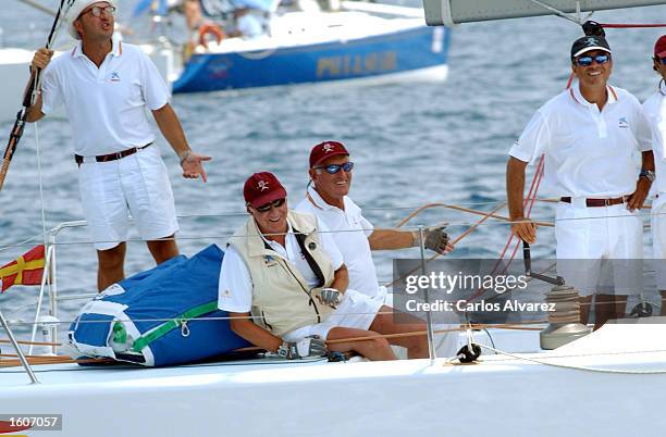 King Juan Carlos of Spain, second left, poses for with the crew of the ship "Bribon" during the last day of the 20th "Copa del Rey" regatta August 5,...