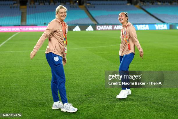 Alessia Russo and Katie Zelem of England share a joke during stadium familiarisation at Stadium Australia on August 11, 2023 in Sydney, Australia.