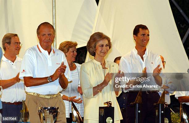 King Juan Carlos, Queen Sofia and Prince Felipe applaud during an awards ceremony of the 20th "Copa del Rey" regatta August 5, 2001 on Palma de...