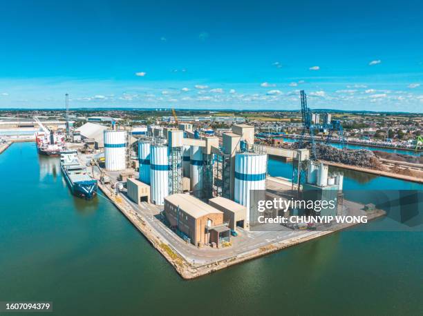 tilbury grain terminal river thames ships loading drone aerial view - cement factory stock pictures, royalty-free photos & images