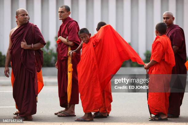 Buddhist monks and activists of Sri Lanka's national heritage party stage a peaceful protest over the release of a recent UN report accusing the...