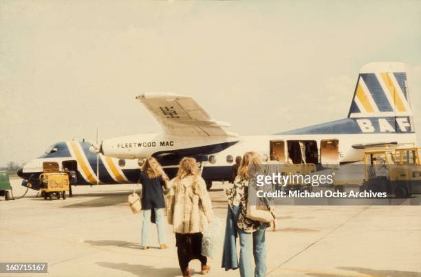 Rock group 'Fleetwood Mac' boards their private jet in circa 1975.
