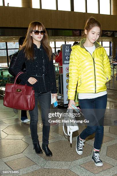 Seohyun and Yoona of South Korean girl group Girls' Generation are seen at Gimpo International Airport on February 4, 2013 in Seoul, South Korea.