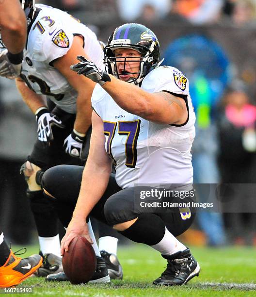 Offensive linemen Matt Birk of the Baltimore Ravens calls out the defense during a game against the Cleveland Browns at Cleveland Browns Stadium in...