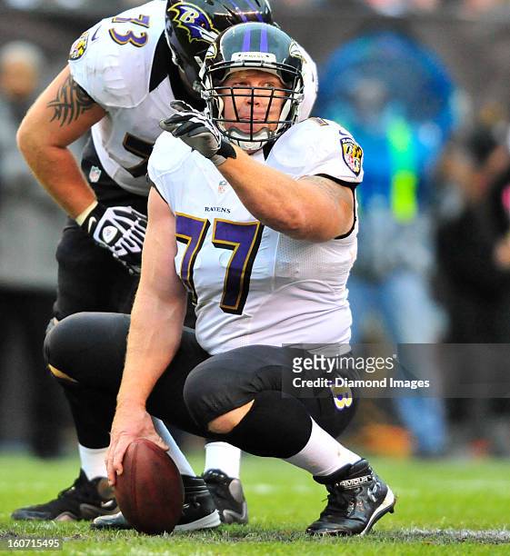 Offensive linemen Matt Birk of the Baltimore Ravens calls out the defense during a game against the Cleveland Browns at Cleveland Browns Stadium in...