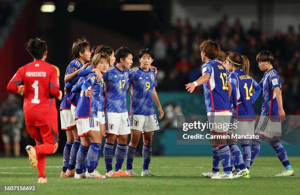 Japan players huddle after their first goal during the FIFA Women's World Cup Australia & New Zealand 2023 Quarter Final match between Japan and...