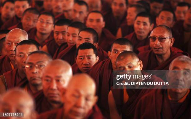 Buddhist monks listen to Tibetan spiritual leader The Dalai Lama during a teaching ceremony at Kalachakra Ground near the historical Mahabodhi Temple...