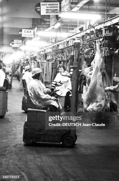 The Halls Of Rungis The Meat Market. Val-de-Marne, Rungis- 22 Avril 1975- Reportage sur les Halles de Rungis et son marché de la viande: un boucher...