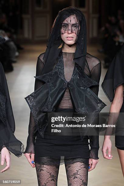 Model walks the runway during New Stylists Podium 4th Edition Fashion Show at Hotel Westin on February 4, 2013 in Paris, France.