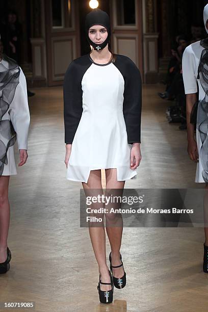 Model walks the runway during New Stylists Podium 4th Edition Fashion Show at Hotel Westin on February 4, 2013 in Paris, France.