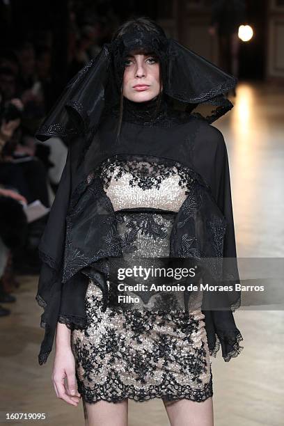 Model walks the runway during New Stylists Podium 4th Edition Fashion Show at Hotel Westin on February 4, 2013 in Paris, France.