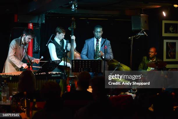 Lewis Wright, Tom Farmer, Nathaniel Facey and Shane Forbes of the band Empirical perform on stage at Pizza Express Jazz Club on February 4, 2013 in...