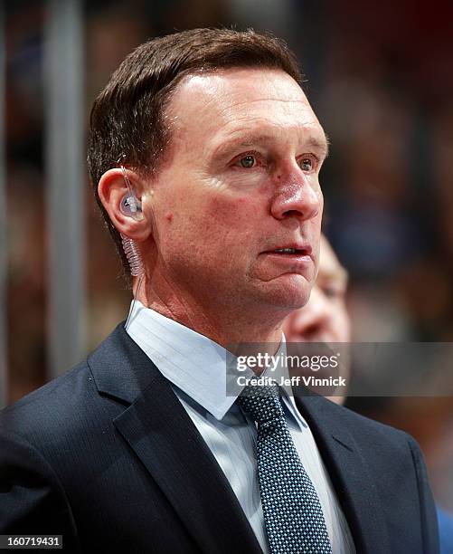 Assistant coach Newell Brown of the Vancouver Canucks looks on from the bench during their NHL game against the Colorado Avalanche at Rogers Arena...