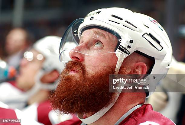 Greg Zanon of the Colorado Avalanche looks on from the bench during their NHL game against the Vancouver Canucks at Rogers Arena January 30, 2013 in...