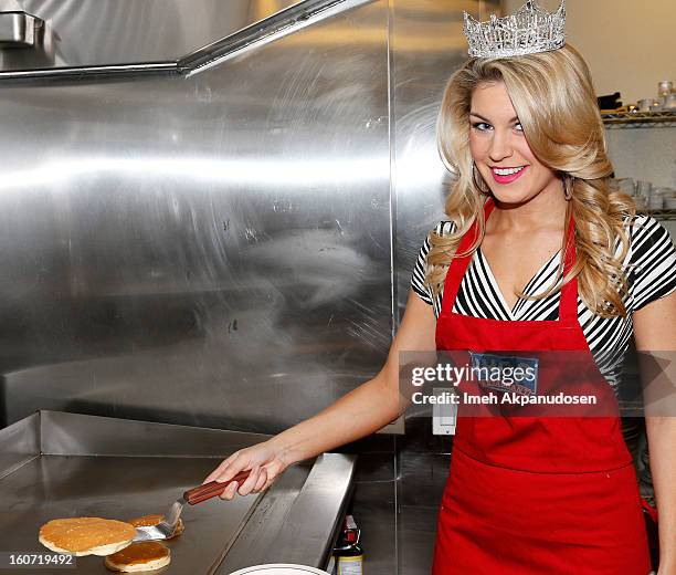 Miss America 2013 Mallory Hagan learns how to make a pancake at IHOP's Headquarters on February 4, 2013 in Los Angeles, California.