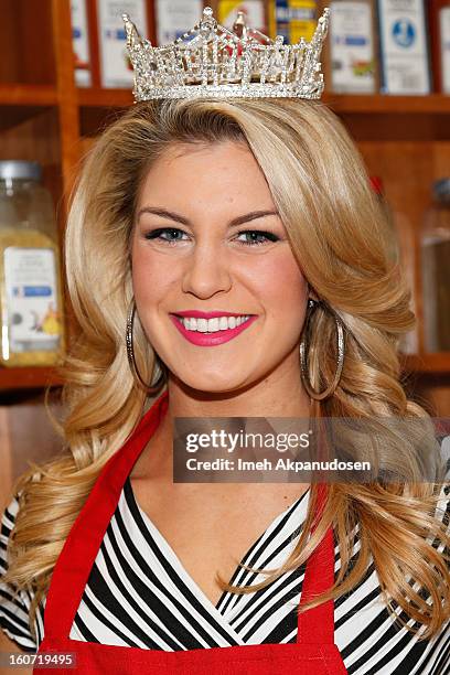 Miss America 2013 Mallory Hagan learns how to make a pancake at IHOP's Headquarters on February 4, 2013 in Los Angeles, California.