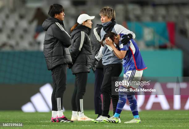 Aoba Fujino of Japan is consoled by her teammate Chika Hirao after the team's 1-2 defeat and elimination from the tournament following the FIFA...