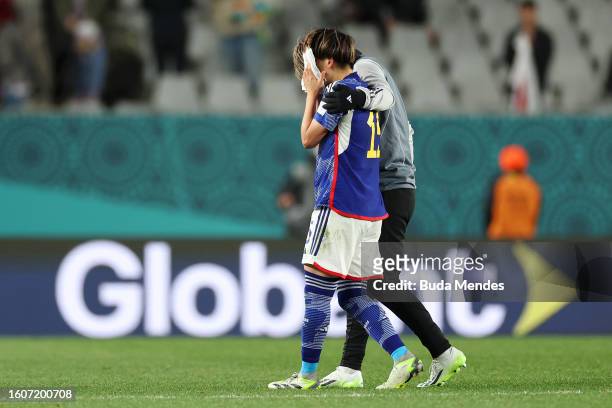 Aoba Fujino of Japan is consoled by her teammate Chika Hirao after the team's 1-2 defeat and elimination from the tournament following the FIFA...