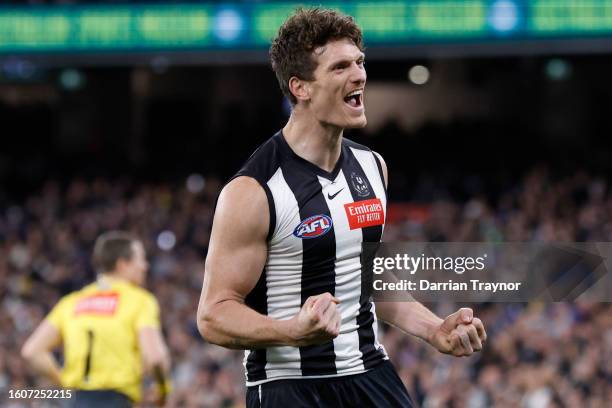 Brody Mihocek of the Magpies celebrates a goal during the round 22 AFL match between Collingwood Magpies and Geelong Cats at Melbourne Cricket...