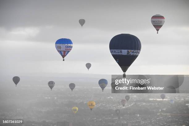 Balloons fly over Bristol during a mass ascent on August 11, 2023 in Bristol, England. The Bristol International Balloon Fiesta, Europe's largest...