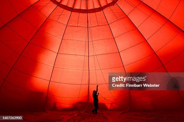 Balloonist prepares for a mass ascent on August 11, 2023 in Bristol, England. The Bristol International Balloon Fiesta, Europe's largest annual hot...