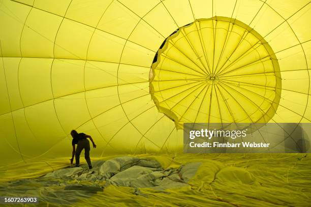 Balloonist prepares for a mass ascent on August 11, 2023 in Bristol, England. The Bristol International Balloon Fiesta, Europe's largest annual hot...