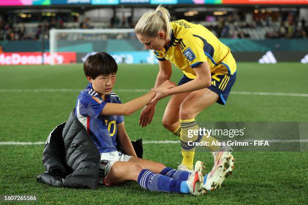 Maika Hamano of Japan is consoled by Jonna Andersson of Sweden after the FIFA Women's World Cup Australia & New Zealand 2023 Quarter Final match...