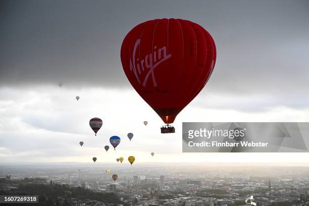 Balloons fly over Bristol during a mass ascent on August 11, 2023 in Bristol, England. The Bristol International Balloon Fiesta, Europe's largest...