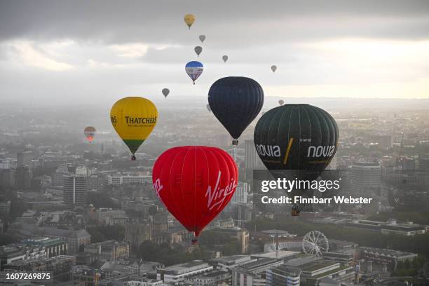 Balloons fly over Bristol during a mass ascent on August 11, 2023 in Bristol, England. The Bristol International Balloon Fiesta, Europe's largest...