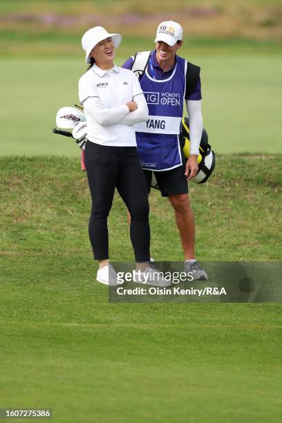 Amy Yang of South Korea laughs with her caddie on the 10th hole on Day Two of the AIG Women's Open at Walton Heath Golf Club on August 11, 2023 in...