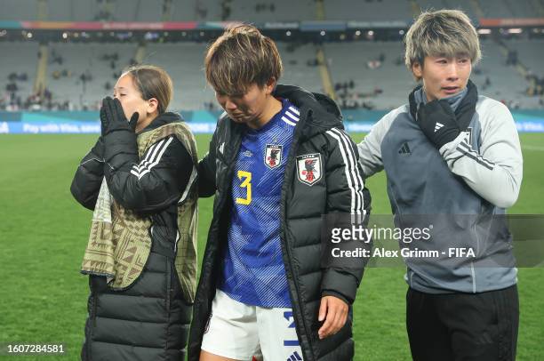 Fuka Nagano, Moeka Minami and Chika Hirao of Japan show dejection after the team's 1-2 defeat and elimination from the tournament following the FIFA...